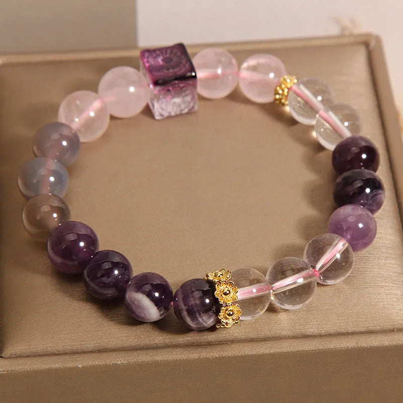 Purple natural amethyst crystal bracelet with rhinestone elements on adjustable band
