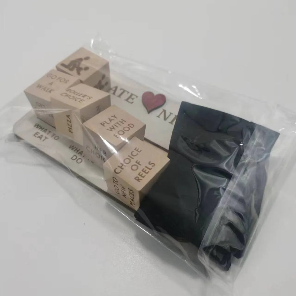 Wooden date night dice set with five natural wood dice on a rectangular planner board next to a black storage bag.