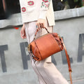 Genuine leather women's shoulder bag in brown, top grain leather, pillow shape, open outer pocket
