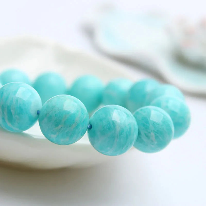 Amazonite gemstone bracelet with polished blue-green beads, shown in 8mm, 9mm, and 10mm size options.