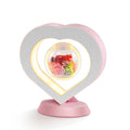 Magnetic levitation lamp with pink eternal rose inside transparent sphere and Bluetooth speaker on USB base