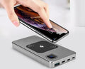 Black alloy mobile power bank with LCD screen showing battery level, next to red and blue versions.