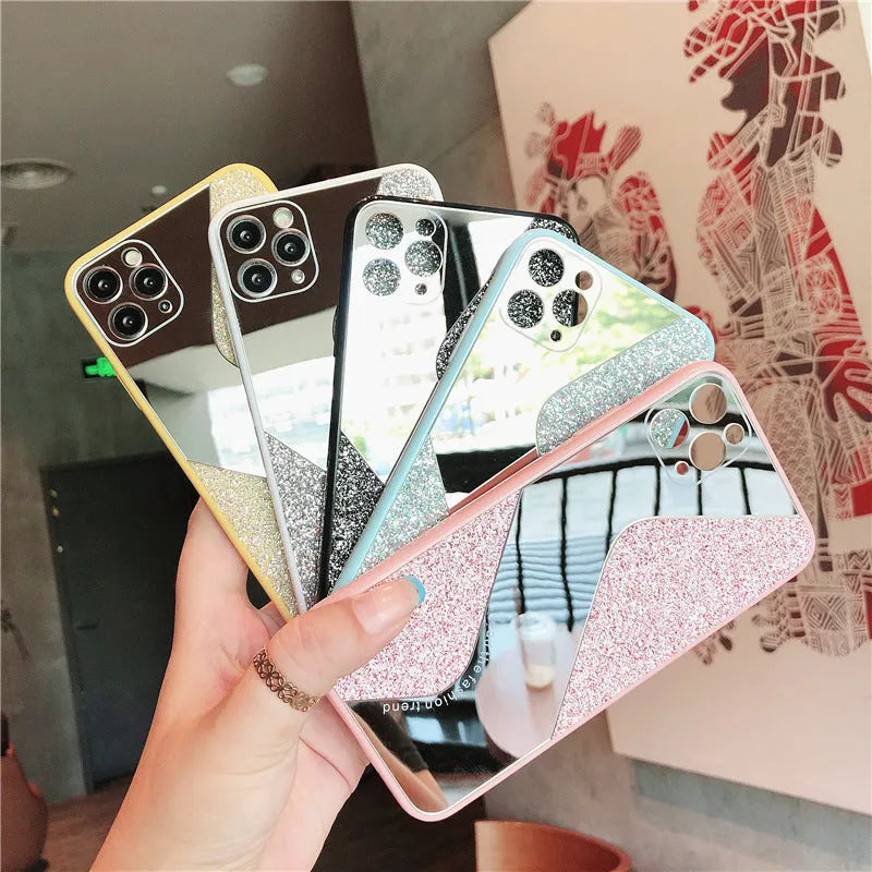 A glitter mirror finish iPhone case with personalised rhinestone detailing, shown in black, blue, and pink colours.