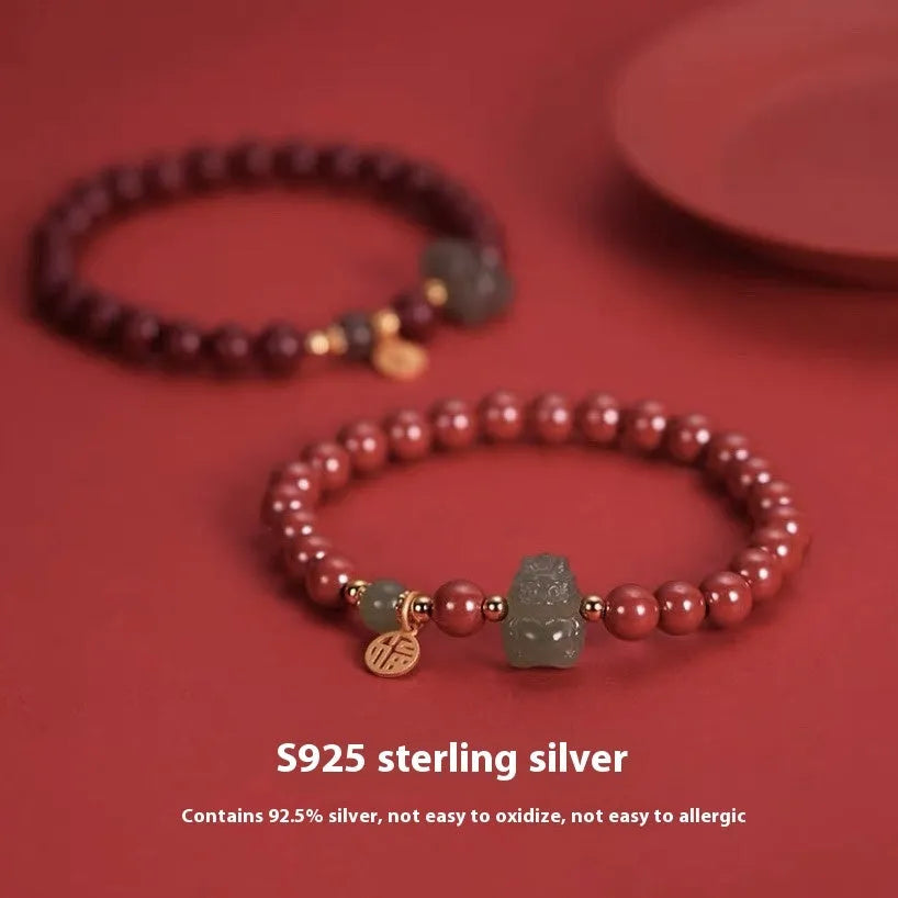 Natural Hetian jade bracelet with 8mm beads showing zodiac motifs in emperor sandstone style