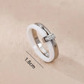 Women's titanium steel heart-shaped double ring with glossy stitching and inlaid zirconium detail.