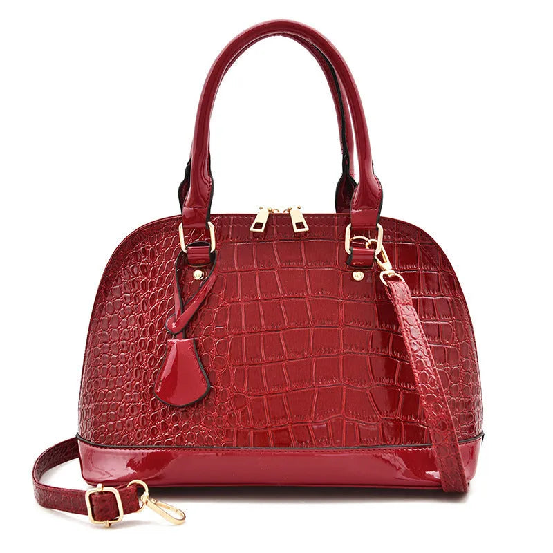 Shiny PU leather crossbody shoulder bag with shell-shaped design in black, red, or brown