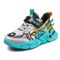 Boy's yellow artificial leather running shoes with Velcro strap and cartoon pattern, shown on a rubber sole.