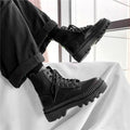 Men's black Dr Martens platform ankle boots with a side zip and frosted leather uppers.