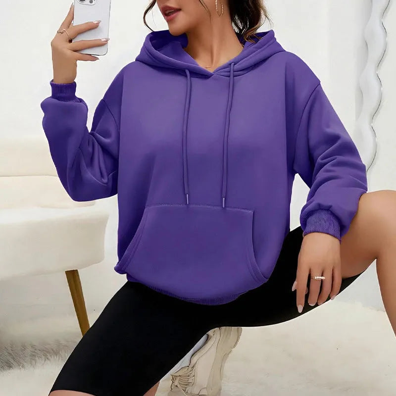 Women's loose grey drawstring hoodie with front pocket, laid flat.