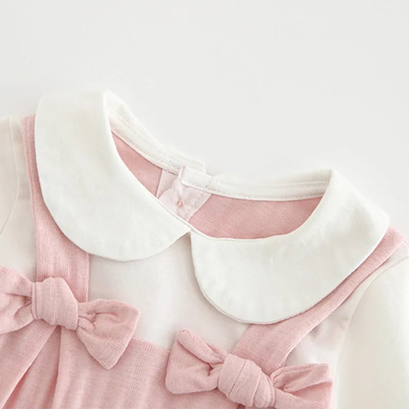 Pink baby girls embroidered jumpsuit with long sleeves and a single-breasted closure.