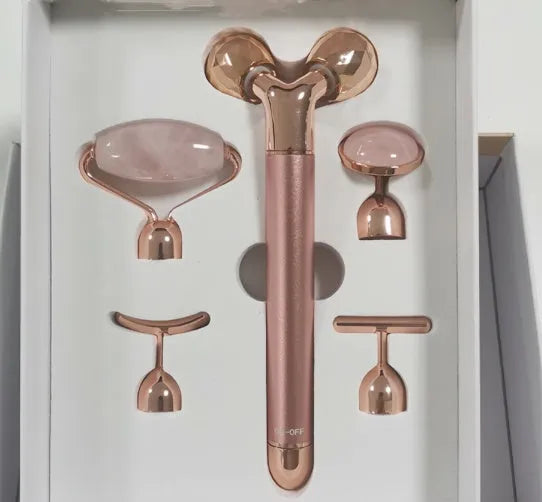 Rose gold five-in-one vibrating face massager with jade roller, disc, U-shaped and T-shaped beauty heads in colour box