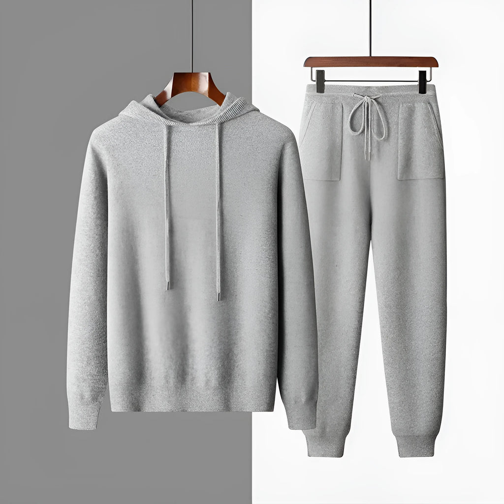 Men's light grey cashmere hooded sweatshirt and matching trousers laid flat.