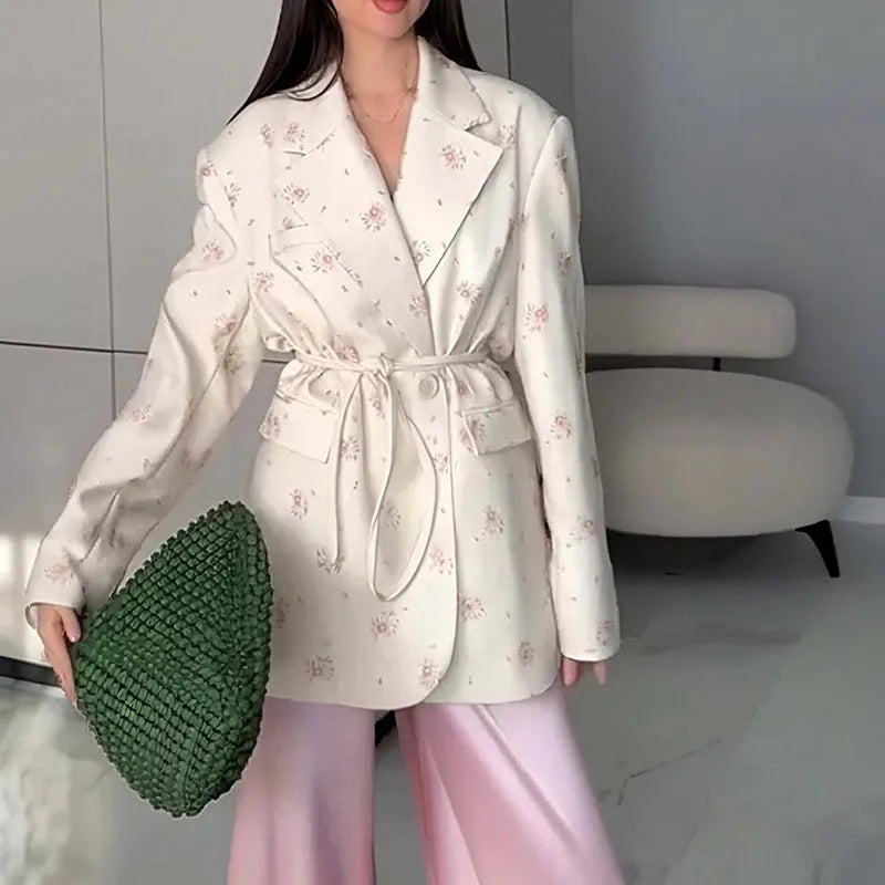 Polyester suit jacket with an adjustable lace-up collar at the waist, shown in a floral print colour option.