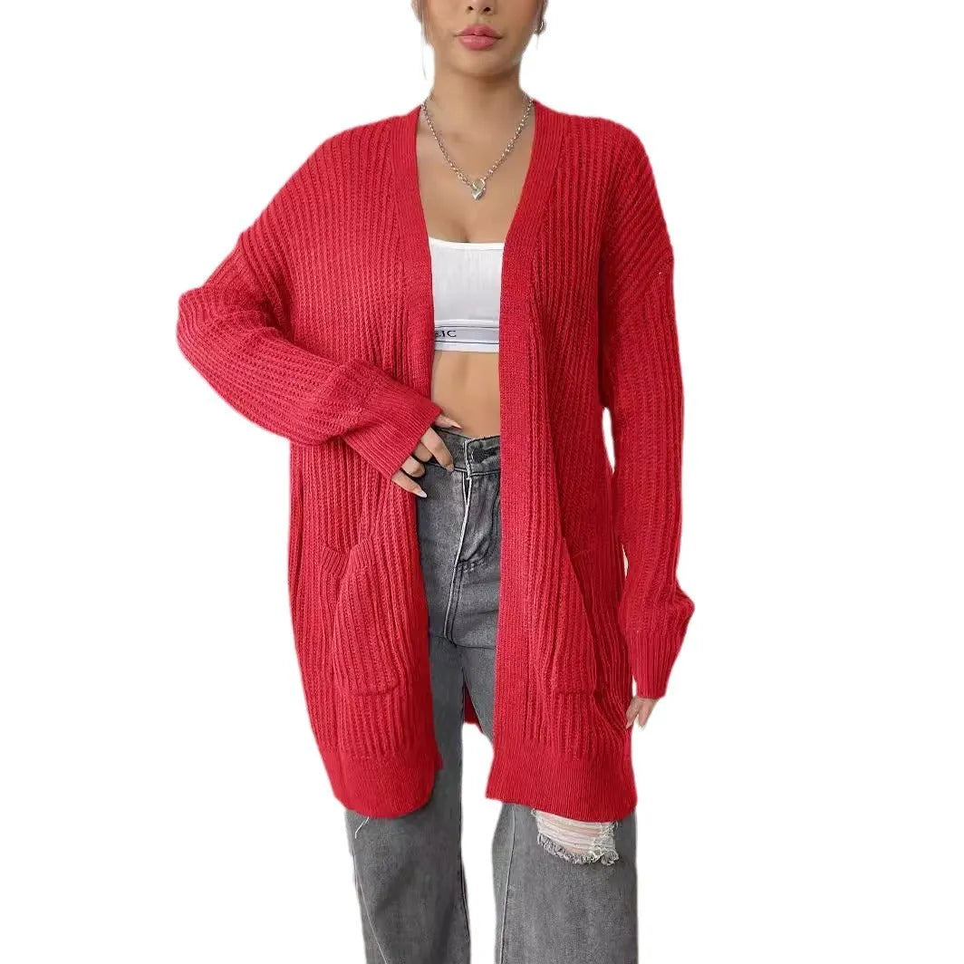 Women's loose fit acrylic cardigan with double pockets in dark green colour showing mid-length design