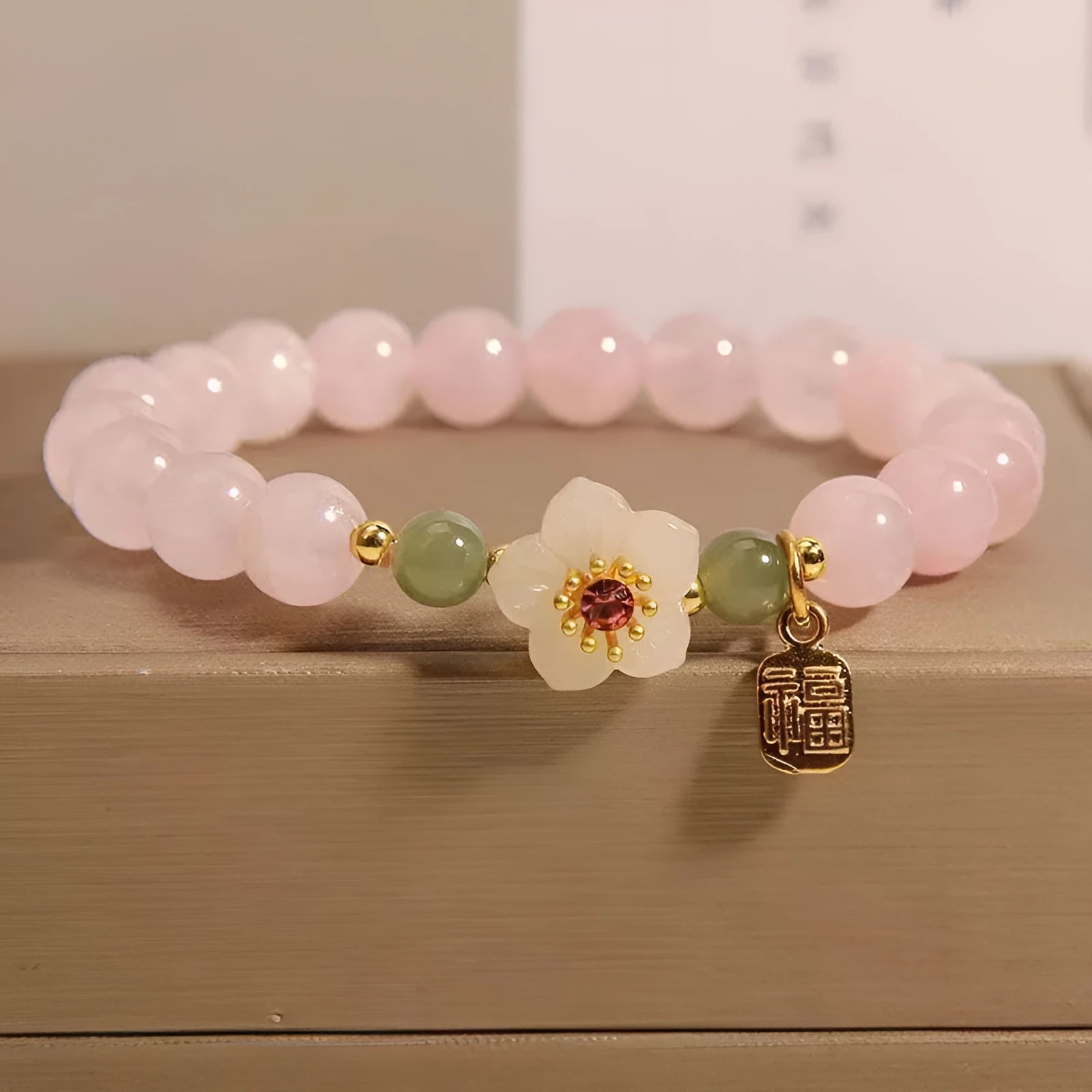 Women's crystal bracelet with peach blossom design and Hetian jade beads in blessing card colour