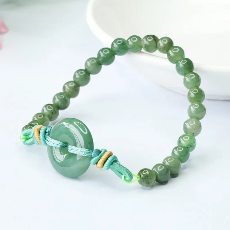 Natural emerald jade bracelet with star-shaped beads and a silver safety buckle.