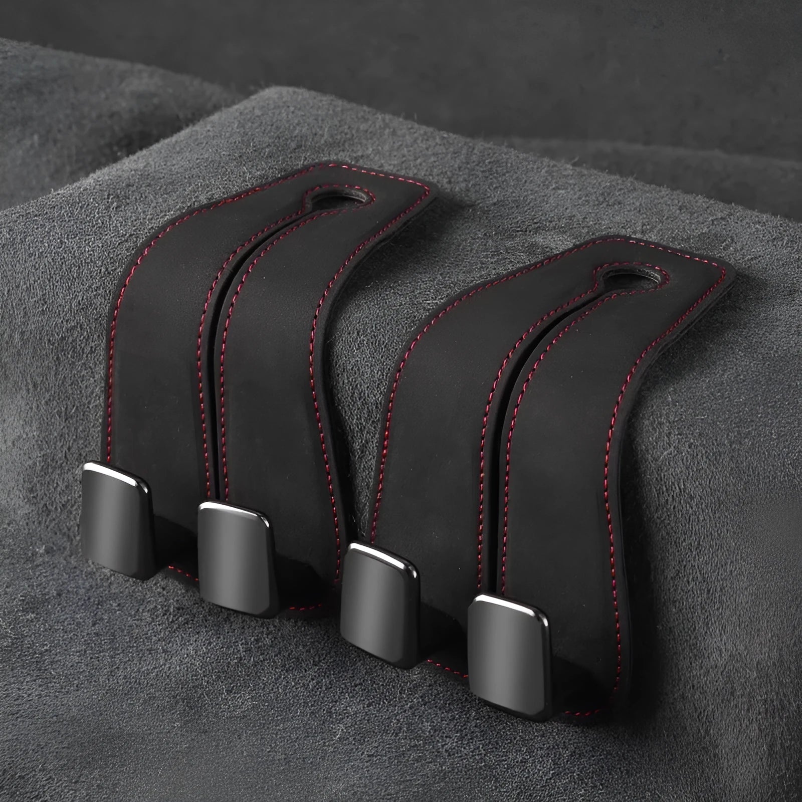 Alloy car seat hook with cartoon style design in black, brown, or grey colour options