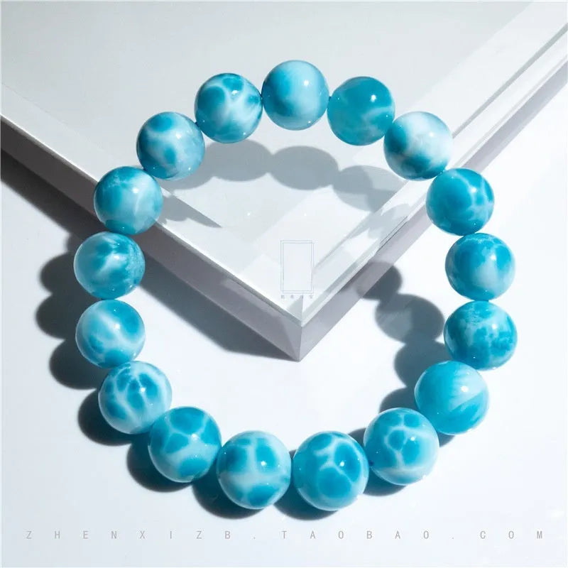 Blue handmade Bodhi bracelet with natural crystal stones and pearl accents in Maillard style.
