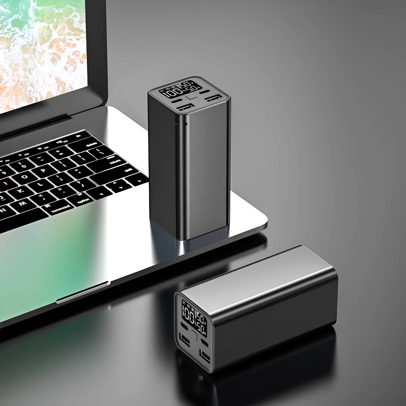 A black 65W high power laptop charging bank with a metal case, showing its dimensions.