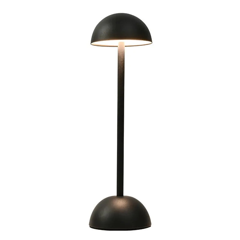 Metal mushroom table lamp in high foot design with white finish on a bar table
