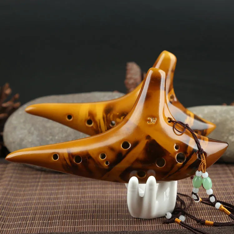 Yellow 12-hole ceramic ocarina in Alto C with 13-note C major range, integrated lanyard, bag and cable