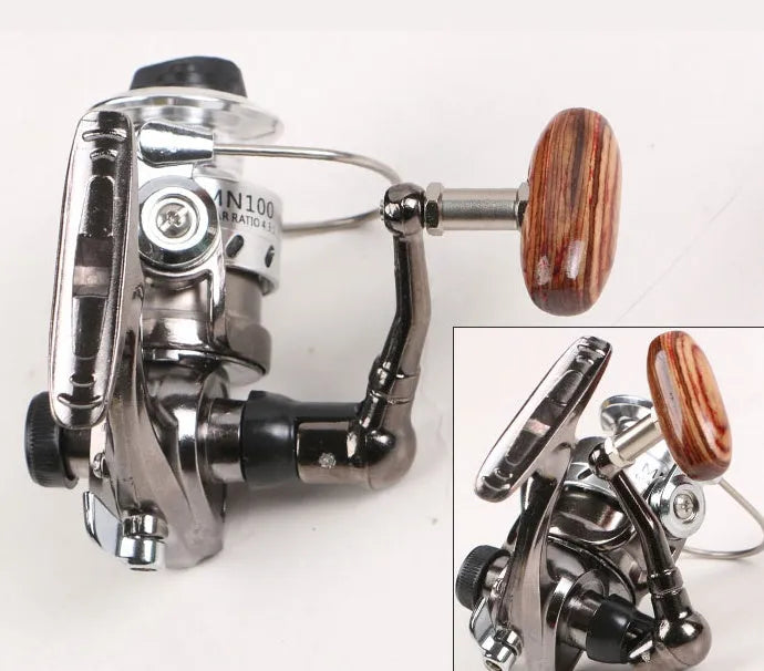 Mini 100 all metal fishing reel in black colour with folding rocker arm and wooden handle