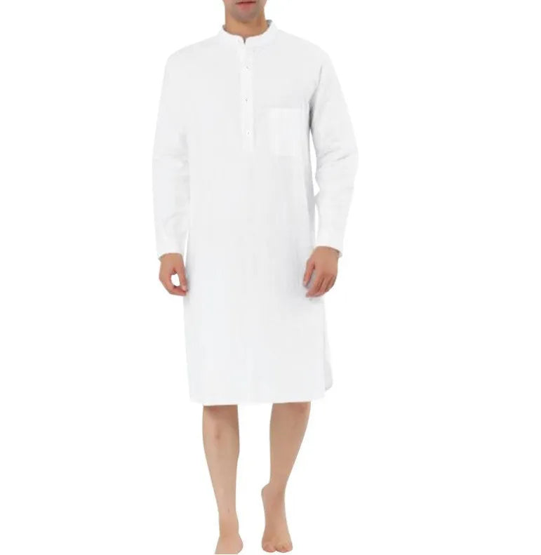 A man wearing a dark blue cotton shirt-style full-length robe for loungewear.