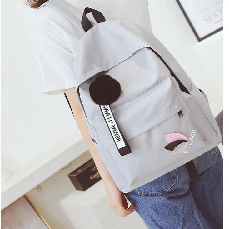 Canvas college style schoolbag backpack in green with leaf pattern, showing 40x28x13cm dimensions