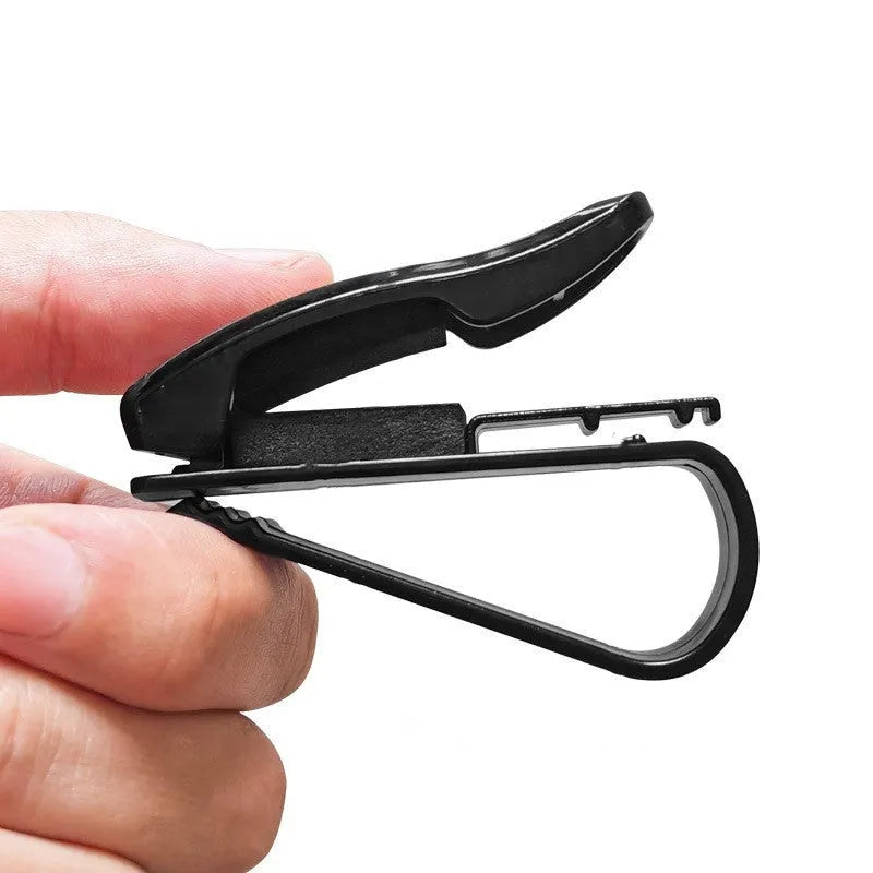 Black plastic car sunshade clip for holding glasses and ID cards, shown next to a ruler showing 6.5cm length.