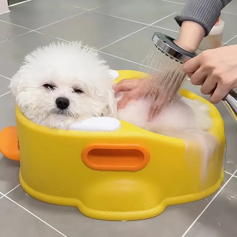 Blue PVC duck-shaped bathtub for washing small dogs and cats on a bathroom floor.