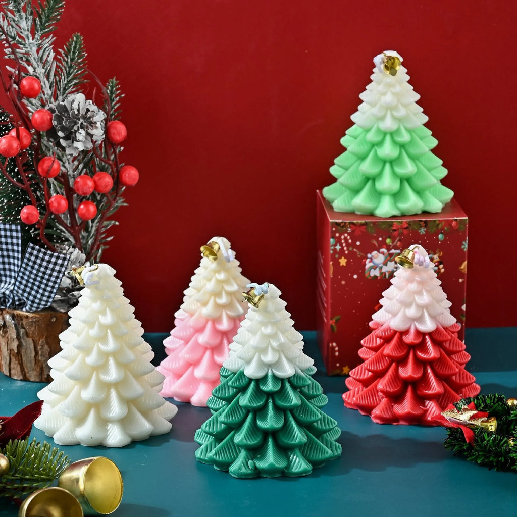 Christmas tree shaped soy wax aromatherapy candle in green on a table with festive home decoration