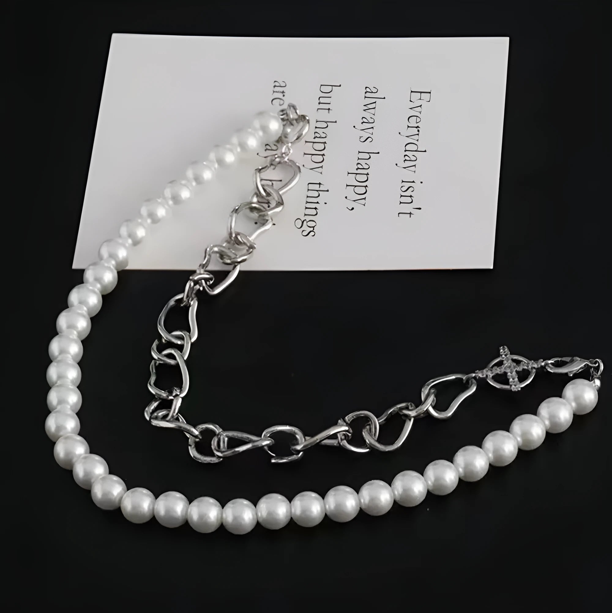 White geometric asymmetric clavicle chain necklace with twisted silver-tone chain and minority design elements