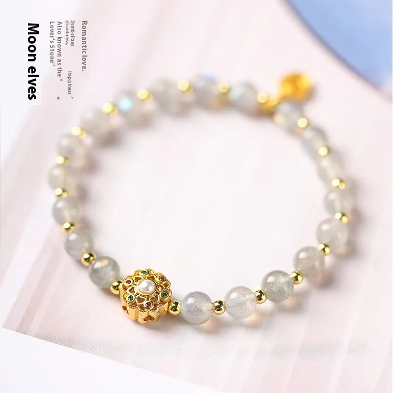 Hand-woven gray moonstone crystal bracelet with pink sunstone and peach strawberry quartz beads