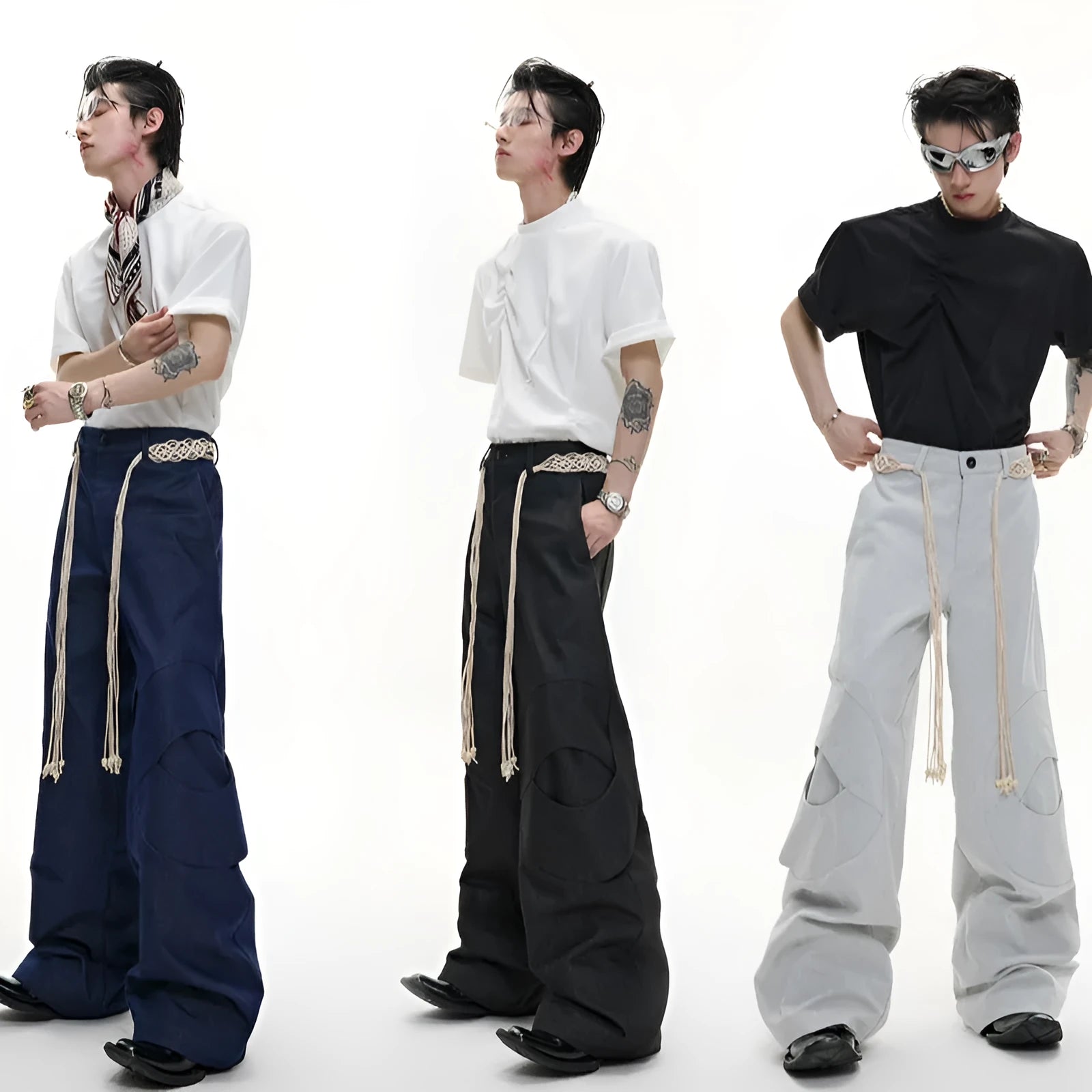 Man's dark blue straight-leg cotton trousers with belt stitching and zipper details on a loose fit.