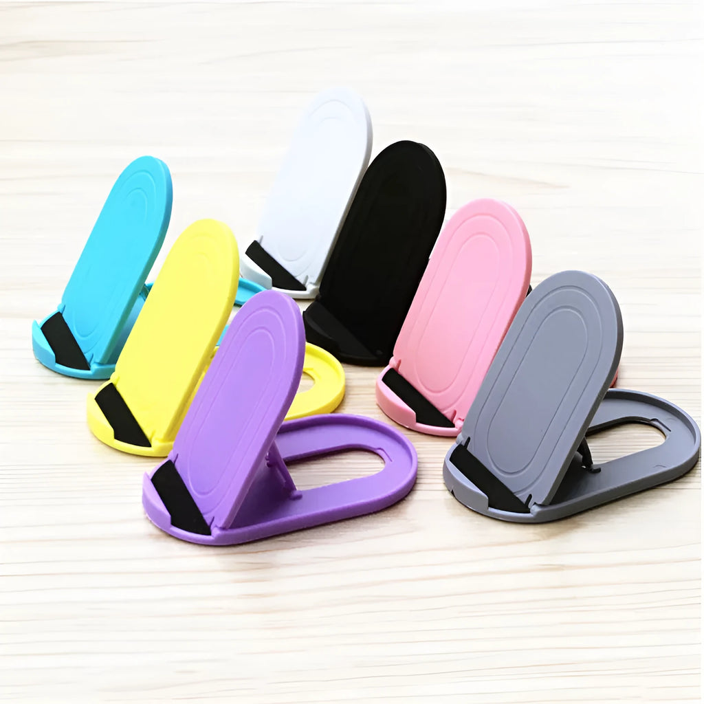 A foldable plastic mobile phone stand in a lazy bracket shape, shown in a selection of colours.
