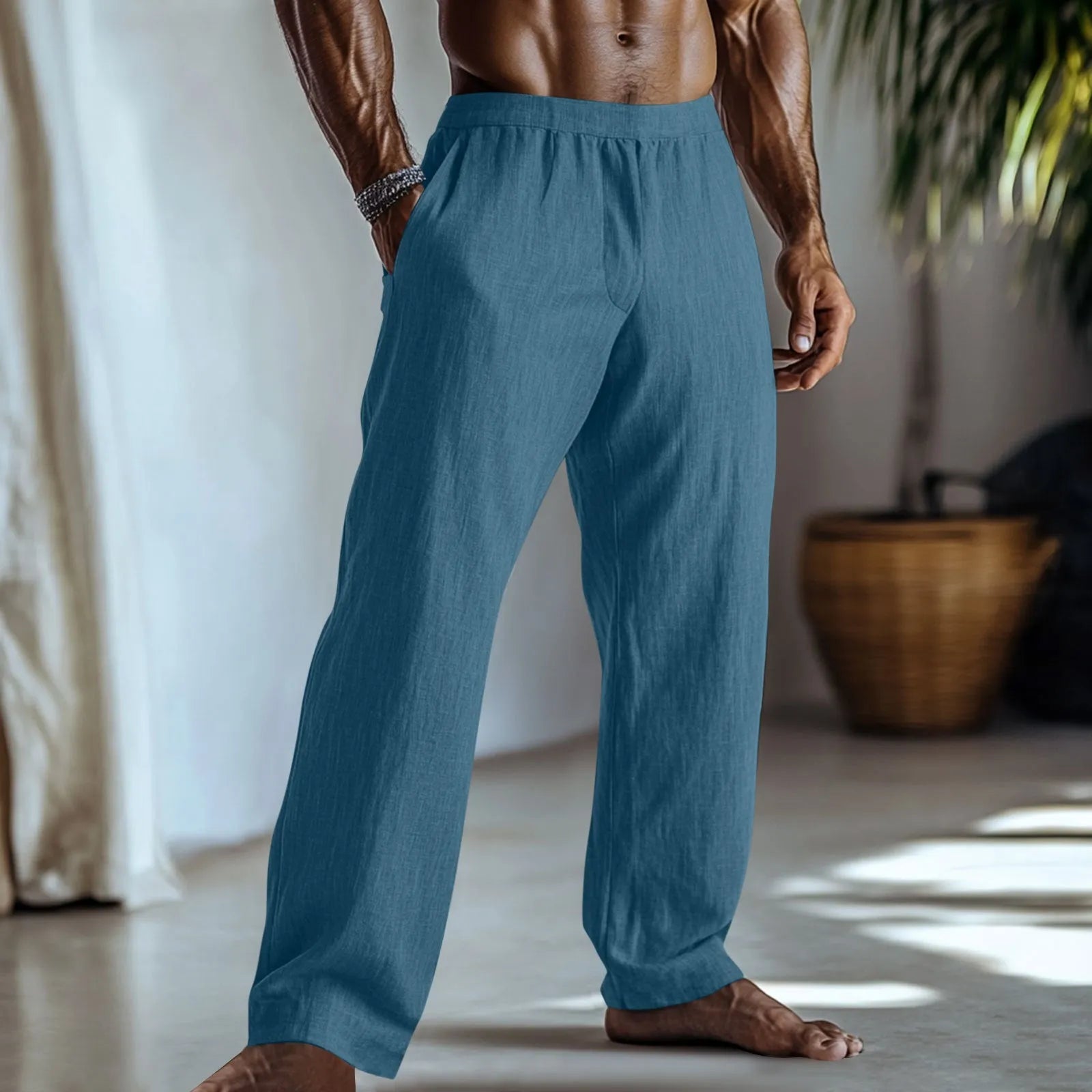 Straight leg casual trousers in cotton and linen fabric, shown in light green colour with side pockets.