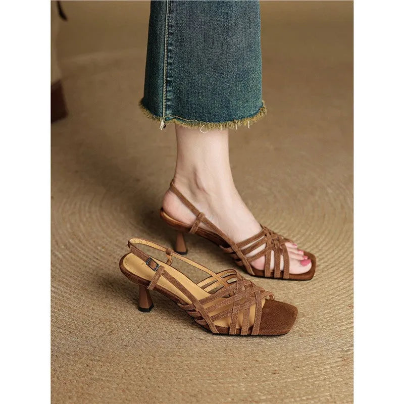 Retro light brown women's high heel sandals with thin cross straps and an ankle buckle on a square toe.