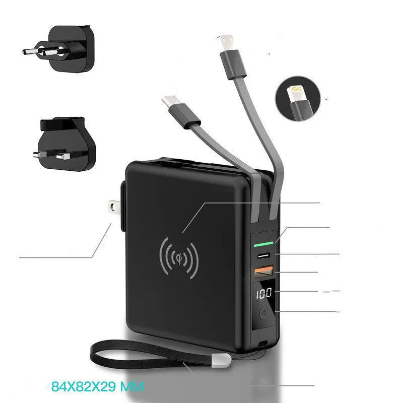 Super Qi wireless power bank in black with folding plug extended and four international adapter heads.