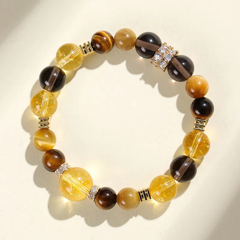 Close-up of a natural yellow artificial crystal bead bracelet with 10mm tower-shaped beads on a string.