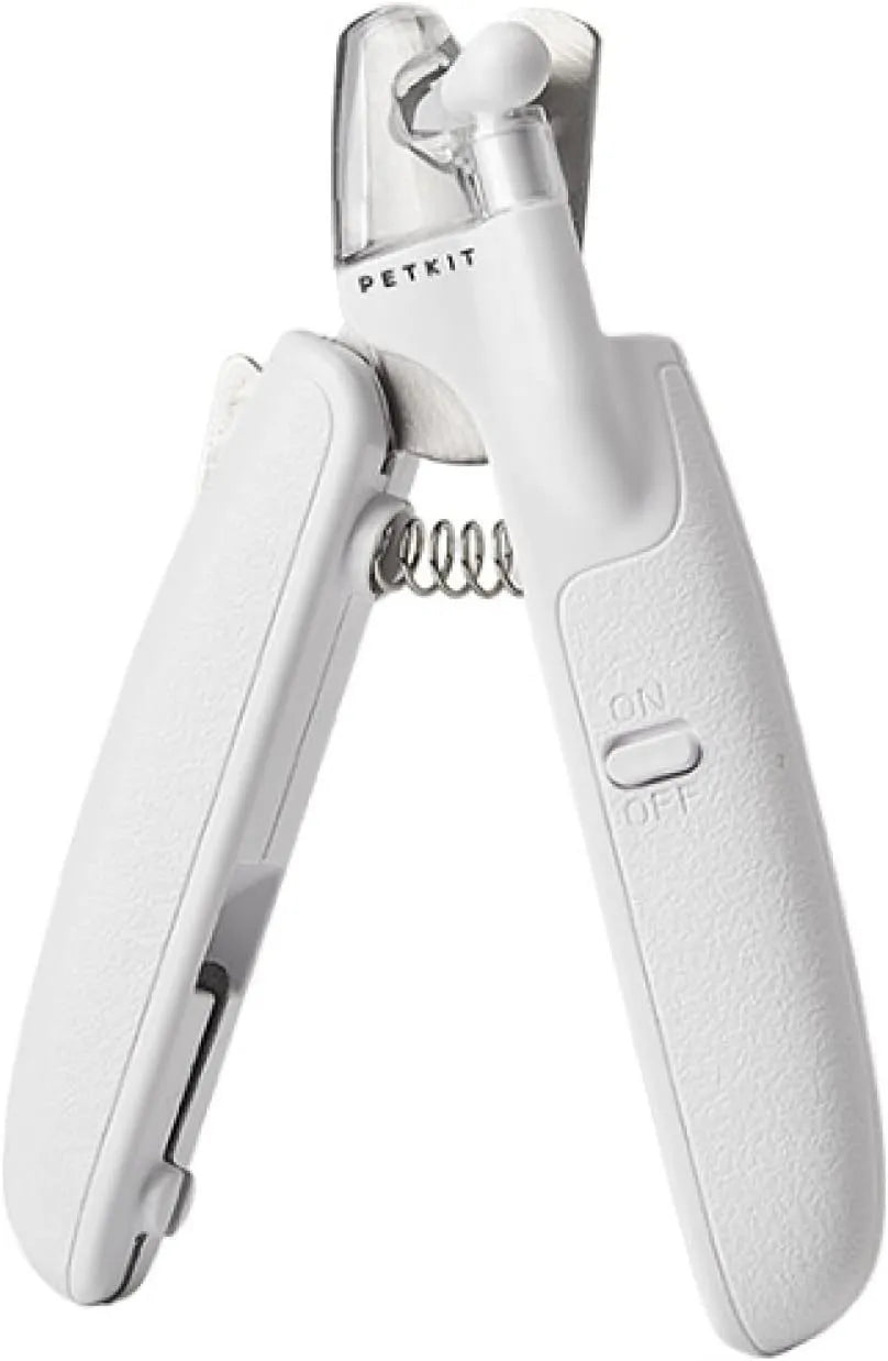 White pet nail clipper with LED light and transparent anti-splash guard on a blue background.