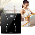 Black electronic body scale with LCD display showing weight measurement up to 180kg