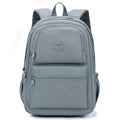 Women's nylon travel backpack in Azure Stone Green showing multiple compartments and organisational features