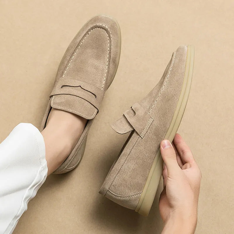 Men's black slip-on leather shoes with oversleeve design and rubber sole.