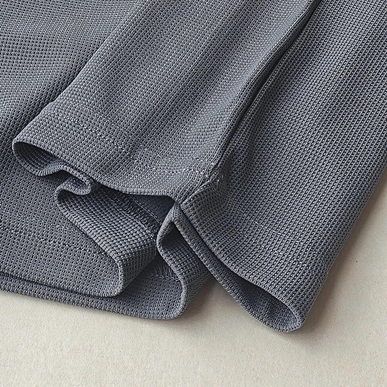 Men's waffle-textured heavy short-sleeved T-shirt in a solid colour, showing detail of fabric texture.