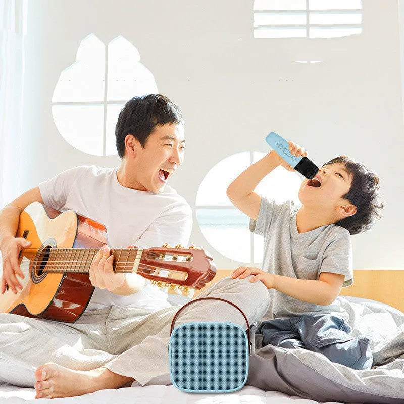 Compact blue, pink or white portable Bluetooth speaker with built-in microphone on a surface.