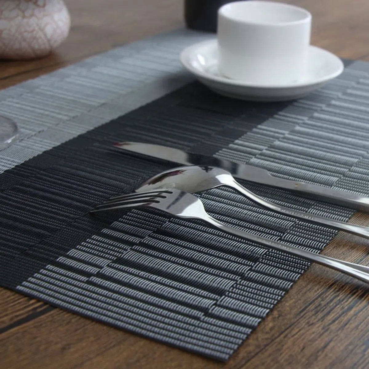PVC non-slip kitchen sink mat in gradient bamboo black colour, shown in 30x180cm size on a countertop.