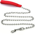Heavy duty metal dog leash with chew-proof chain and soft black padded handle on a concrete background.