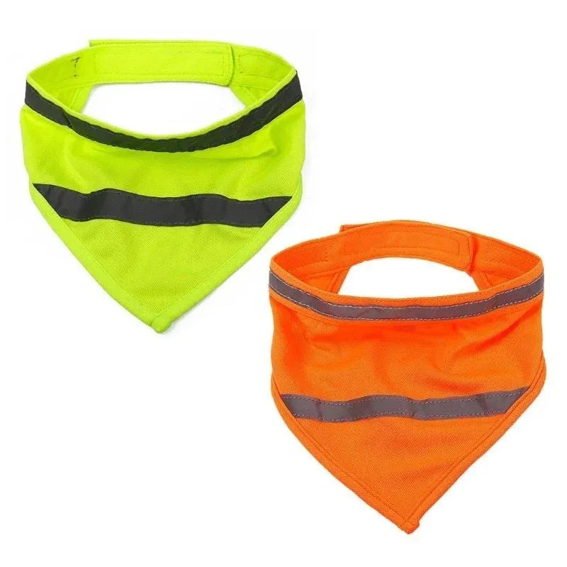 Yellow and orange reflective triangular dog bandana with adhesive strap on a dog's neck.