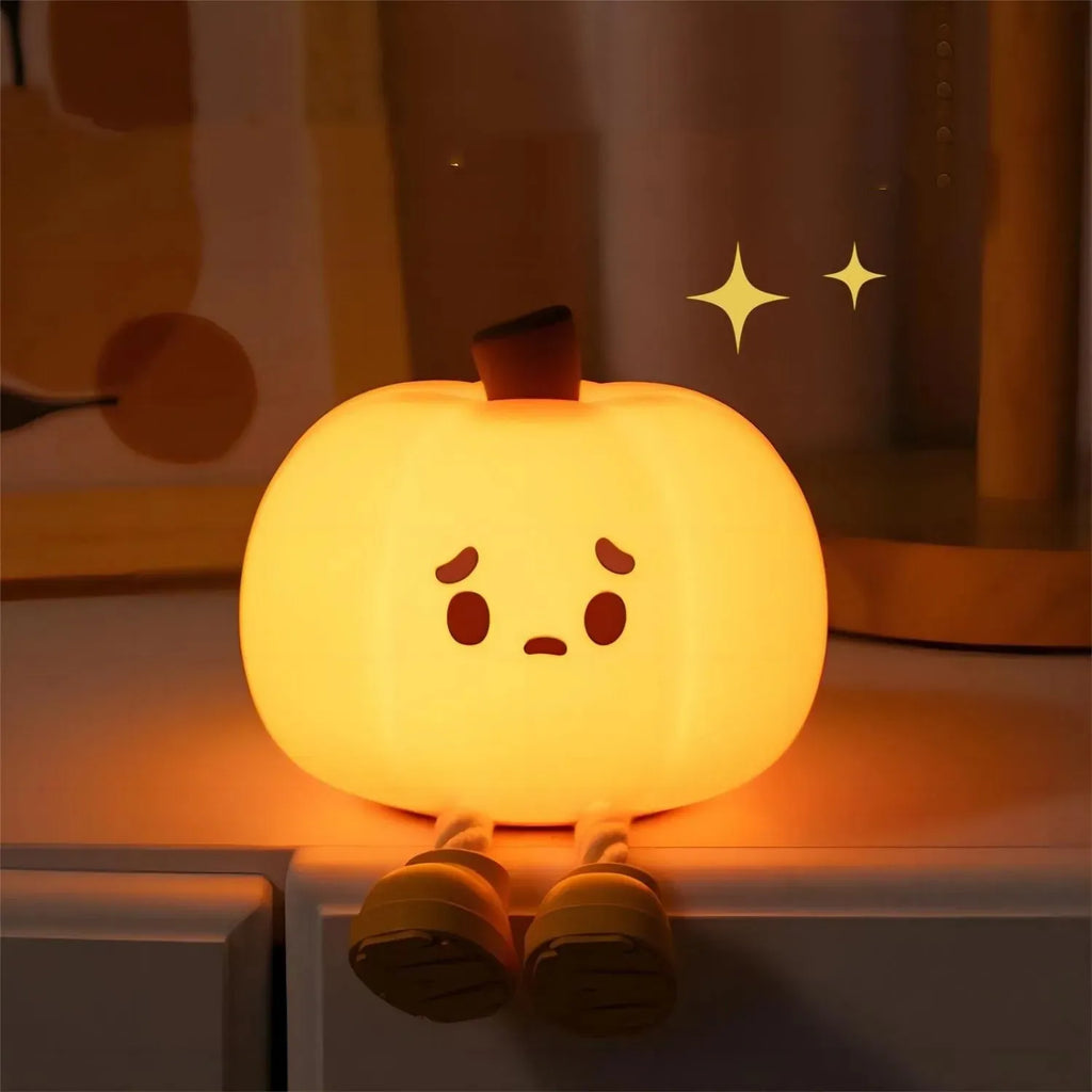 Orange pumpkin silicone night light with soft glowing illumination and touch controls