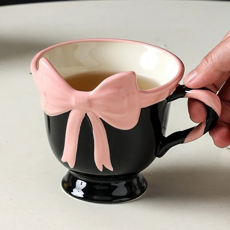 White ceramic mug with heart and bow design, 301-400ml capacity, bow-shaped handle